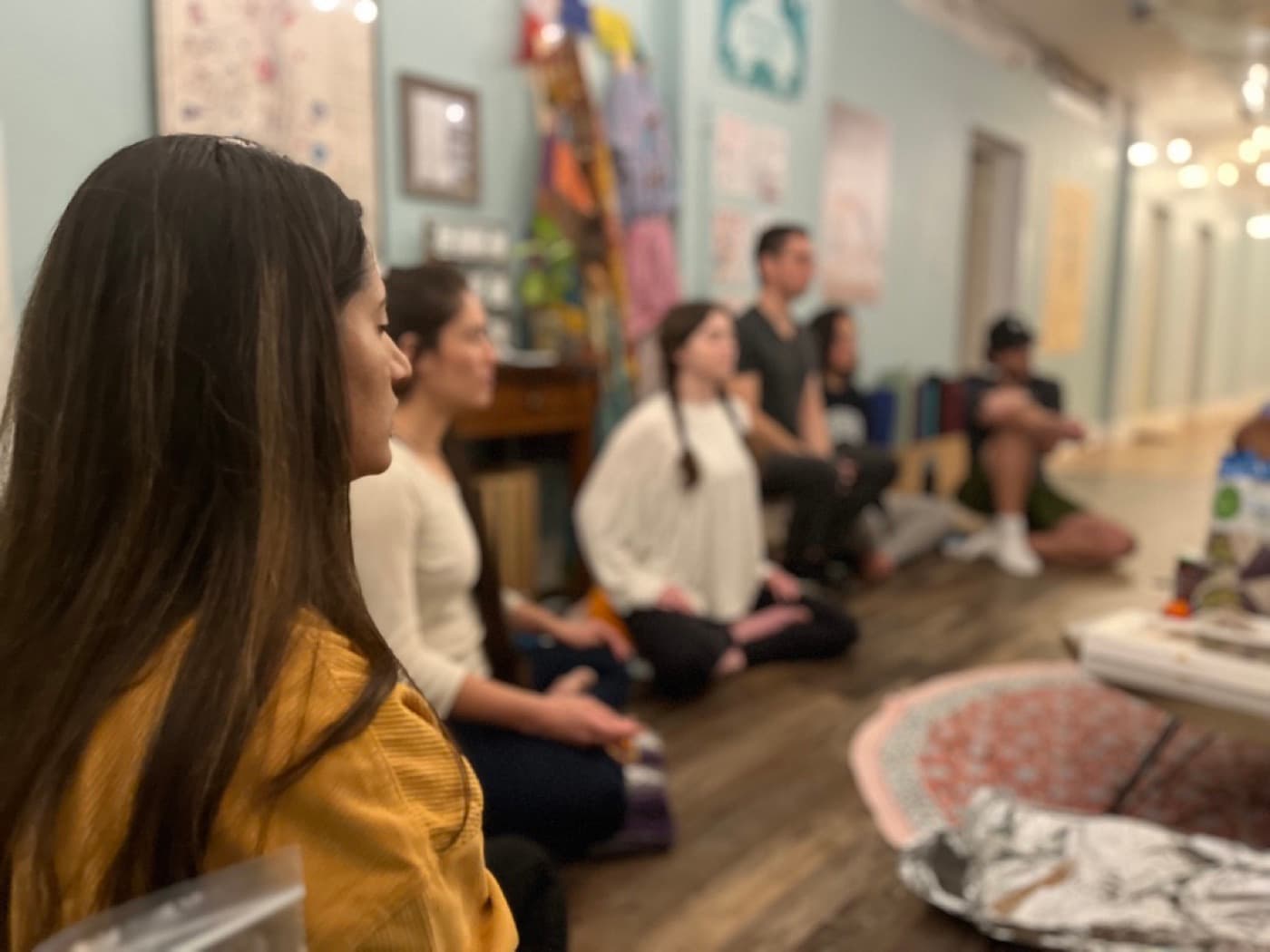 Karma Yoga students sitting together during Philosophy Night.